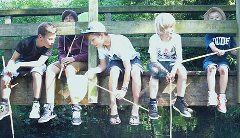 boys-sitting-on-bridge-fishing-web_edited_edited.jpg