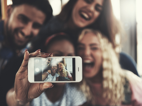 Four people taking a selfie