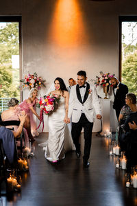 bride and groom walking down aisle after wedding ceremony