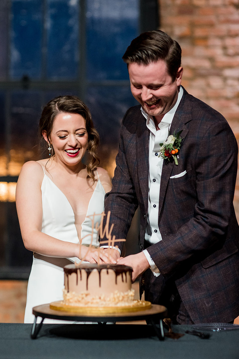 bride and groom cutting cake at clementine hall