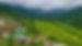 Lush terraced farming on green hills with forest conservation trails.