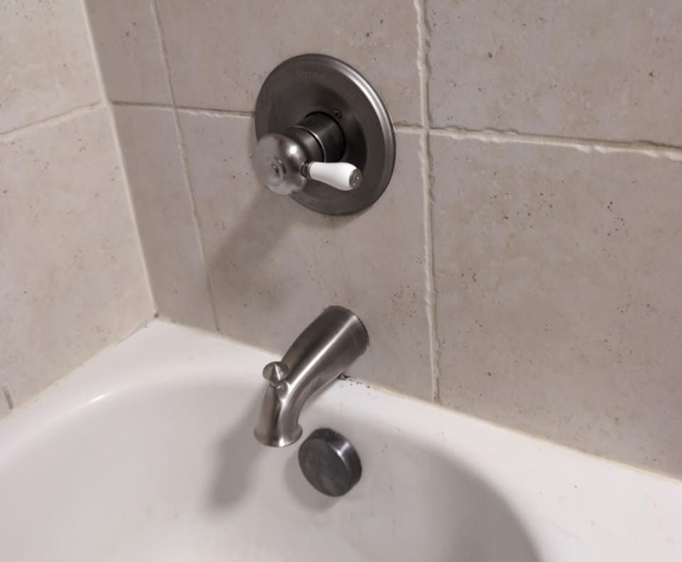 new shower fixtures in bathtub of Lewisville home.jpg