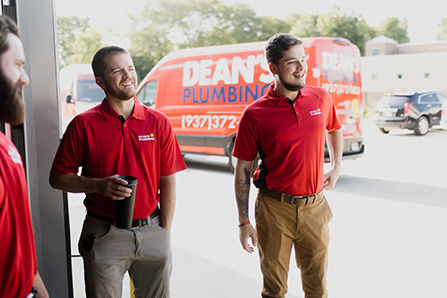 two plumbing techs going to install new water heater