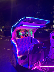 Pedi bike lit up with neon lights