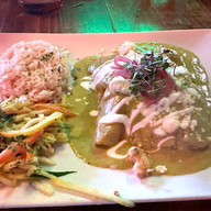 enchiladas with a green sauce and white rice