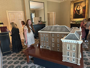 Girl beside Queen Victoria's Dollhouse at Kensington Palace