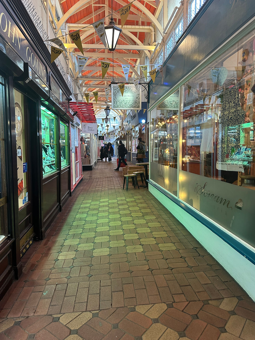 Walkway with stores on each side inside the Covered Market in Oxford