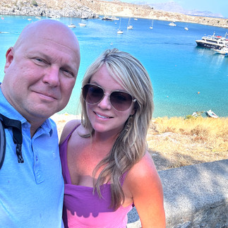 Man and woman with ocean behind them