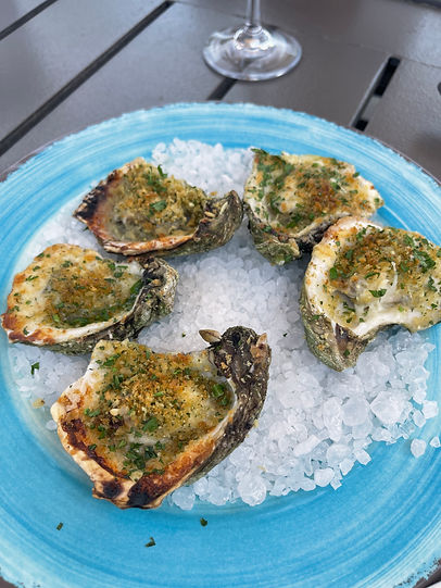 Oysters with breadcrumbs on a plate of ice
