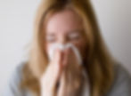 Woman sneezing