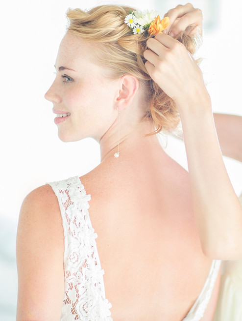 Bride getting hair styled