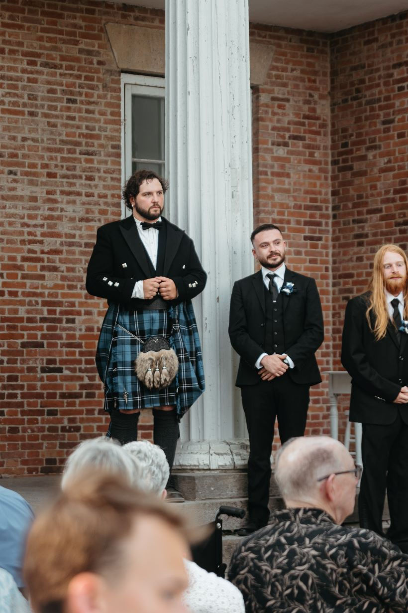 The groom nervously awaits the arrival of his bride for their wedding at Upper Canada Village.