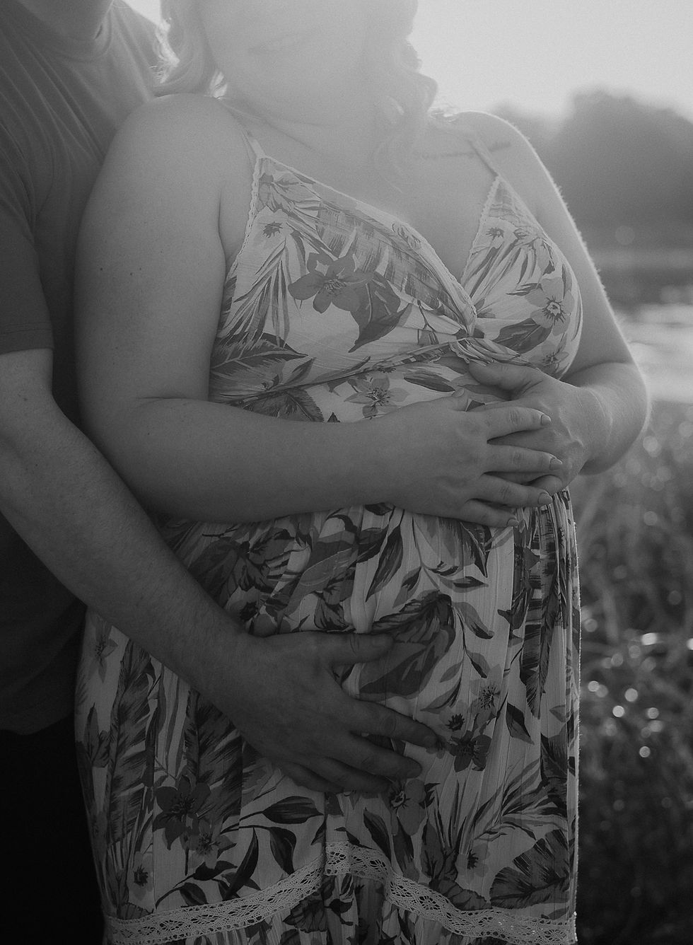 A maternity photograph in black and white.