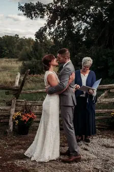 A bride and groom share their first kiss as husband and wife.