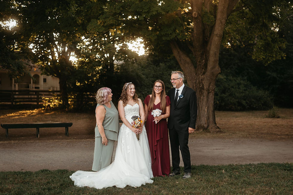 A family portrait of the bride with her family after her wedding at Upper Canada Village.