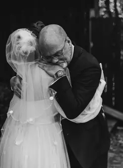 Black and white photograph taken during the first look with the father of the bride.