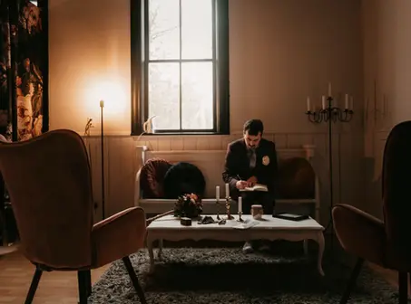 A photograph of a groom going over his vows just before his wedding ceremony.