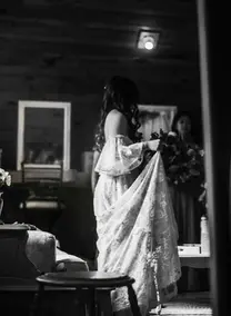 A black and white photograph of a bride before her ceremony.