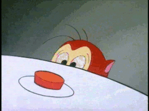 An animated GIF from the show Ren & Stimpy where Stimpy presses a button.