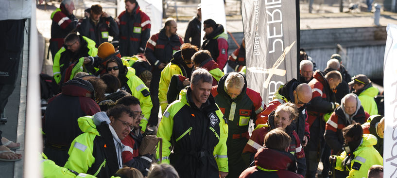 Conference group getting ready for activity with Rib boat