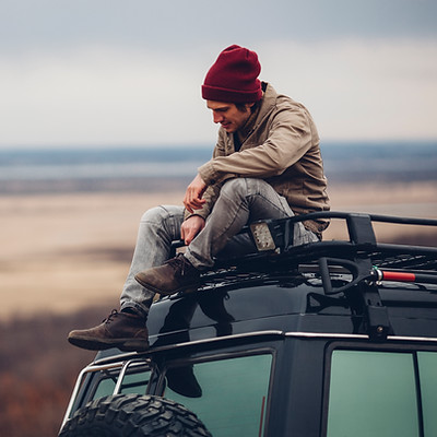 Guy Sitting on Car