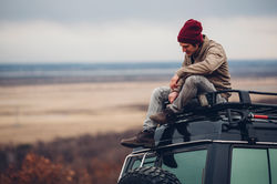 Guy Sitting on Car