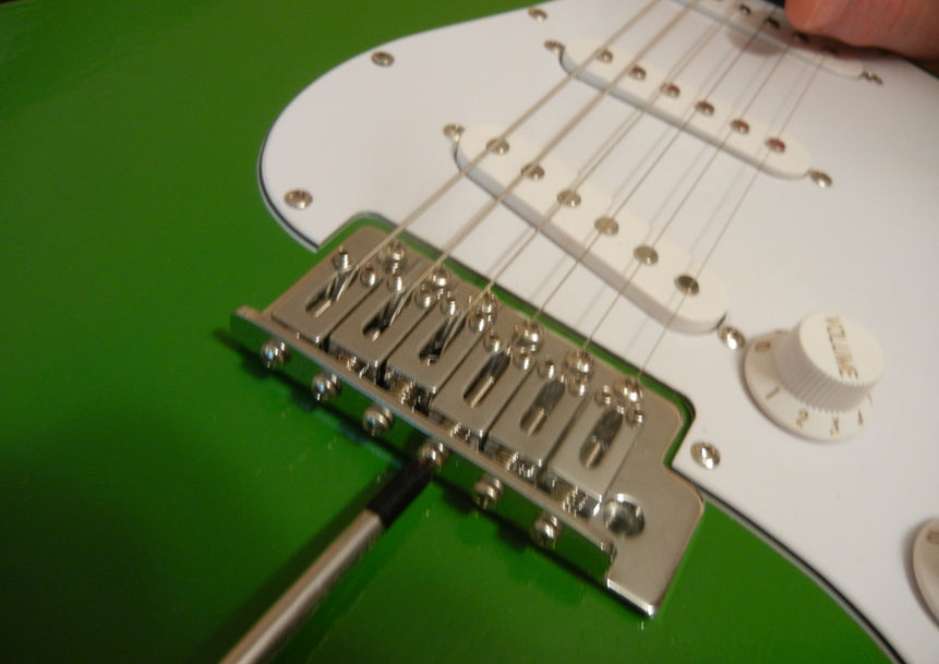 Adjusting for intonation on a guitar