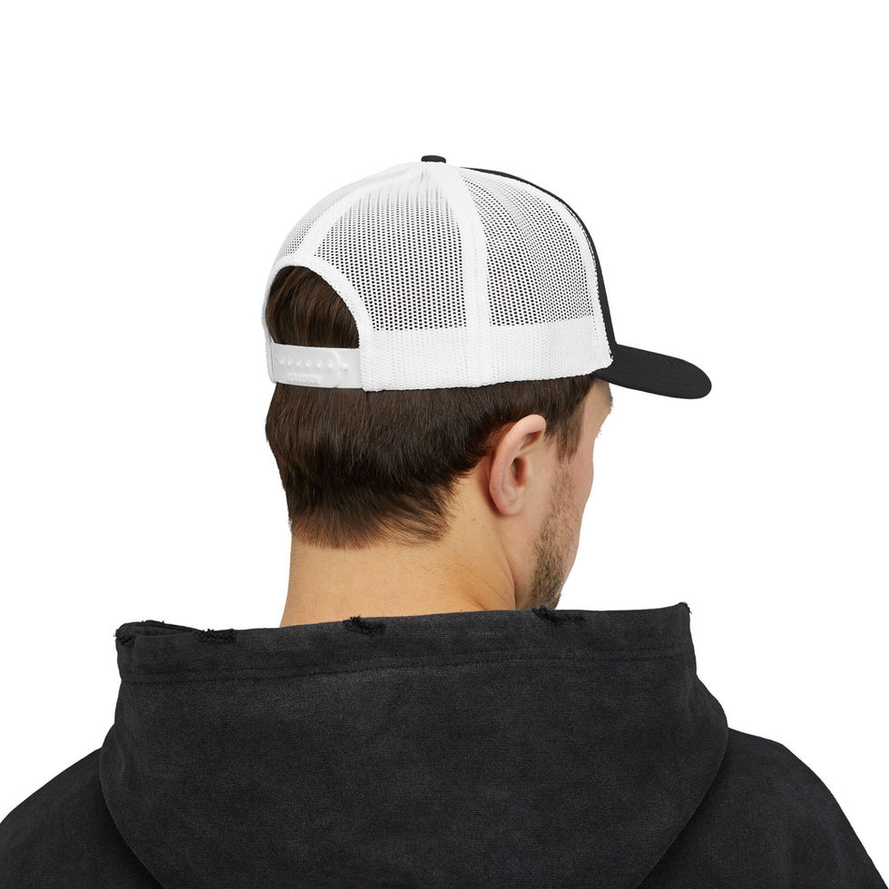 Man wearing black and white mesh back trucker hat