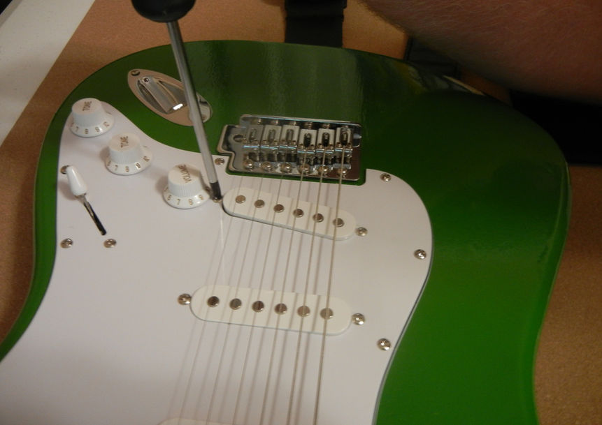 Stratocaster getting its pickup height adjusted