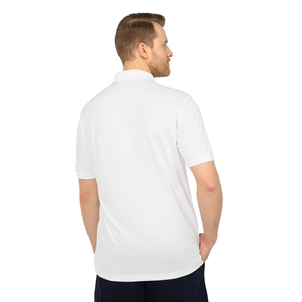 Man wearing a white polo shirt with his hand in his pocket