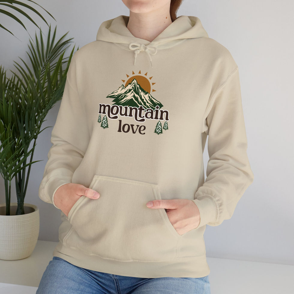 Woman wearing a tan mountain love hoodie front view