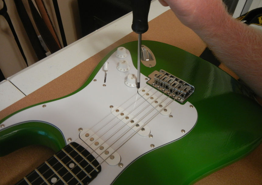 Stratocaster getting its pickup height adjusted