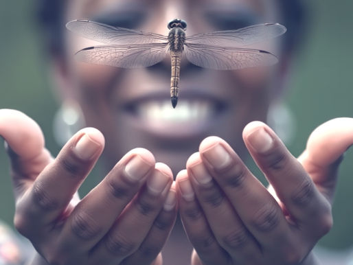 Woman releasing a dragonfly