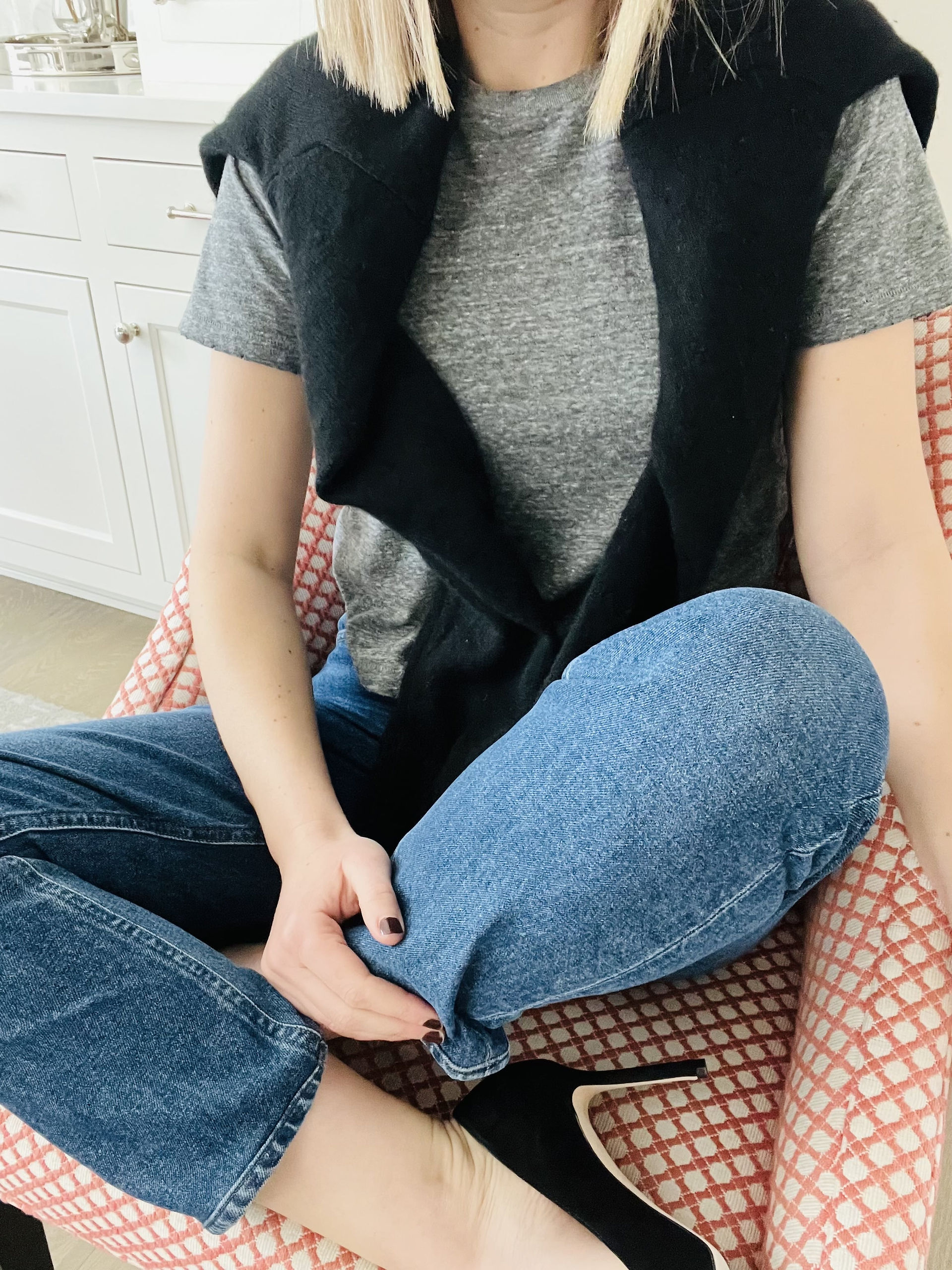 Natalie, Austin Tx personal stylist sitting with legs crossed