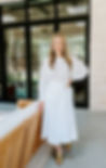 stylist standing in a dress