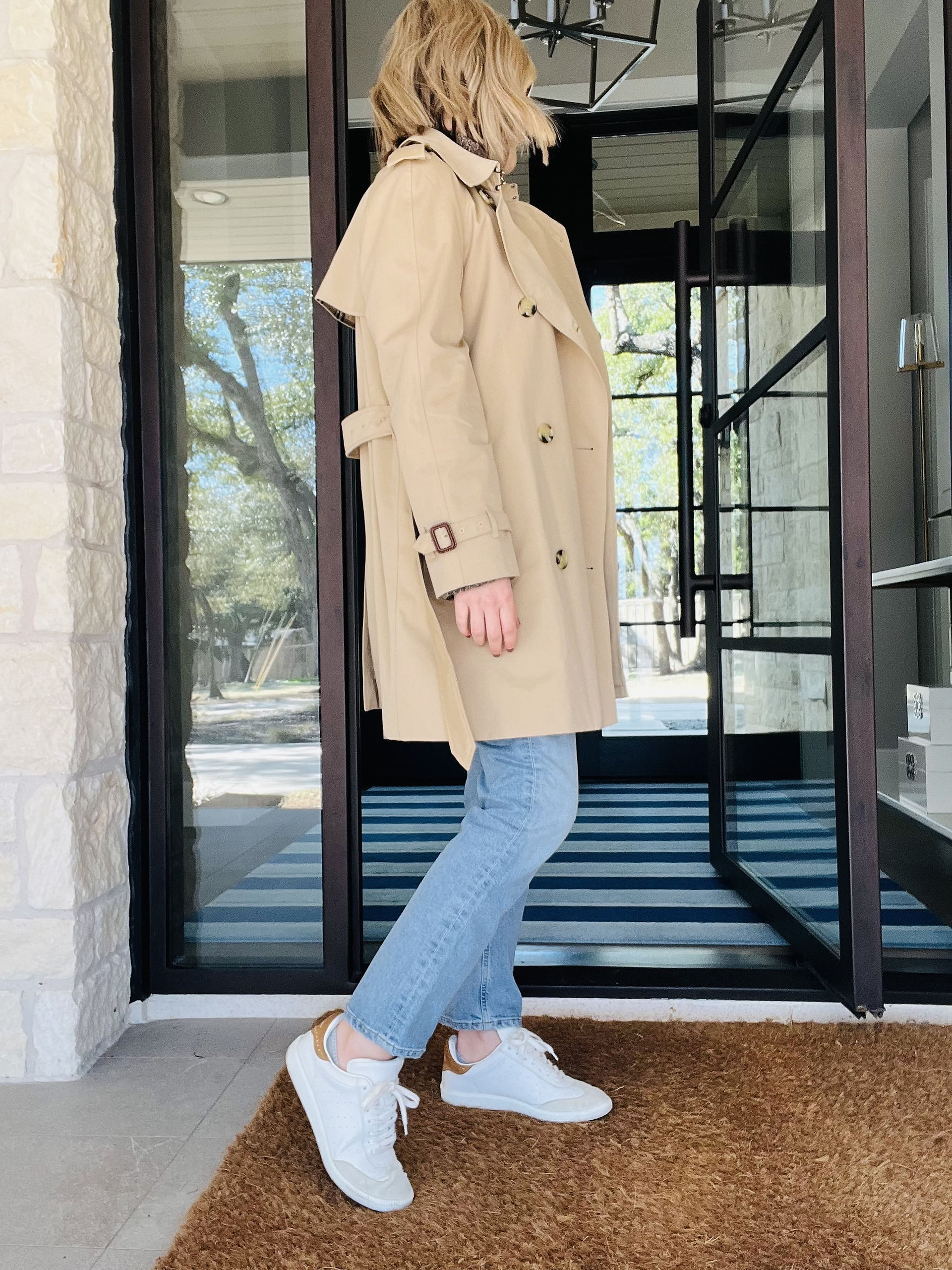 Natalie of Closet Curator wearing trench side view showing sleeve and belt