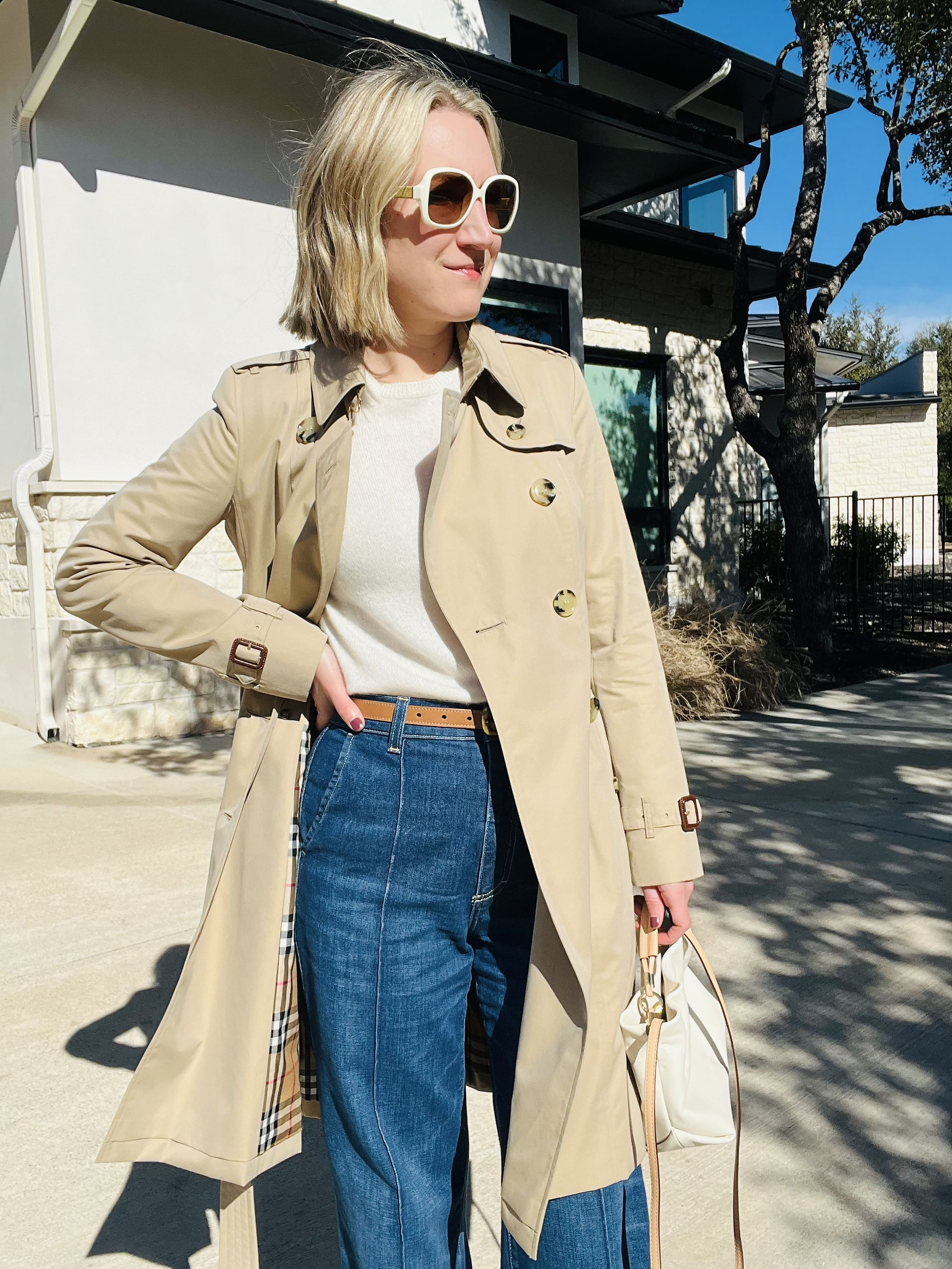 Austin personal stylist Natalie, owner of Closet Curator styling trench coat styled open with wide leg jeans