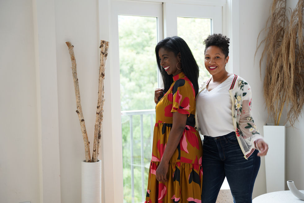 Two business partners posing together during a lifestyle brand photoshoot.