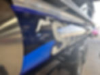 Partial boat wraps on a blue and silver pontoon boat