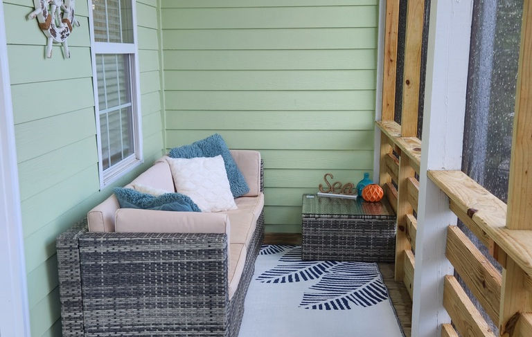 Sitting area in screened porch. 