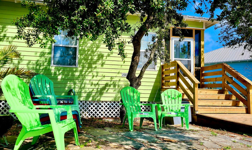 Patio chairs on the front of the condo.