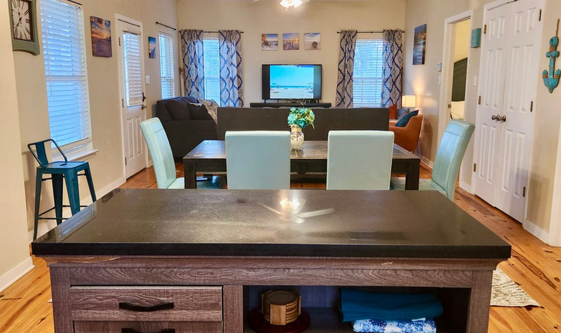 Connected kitchen, dining table and living room area