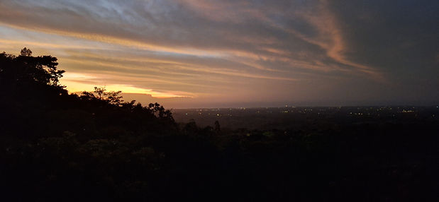 Tranquil sunrise from Finca Colibrí Panama overlooking the mountains and Pacific horizon in San Carlos.