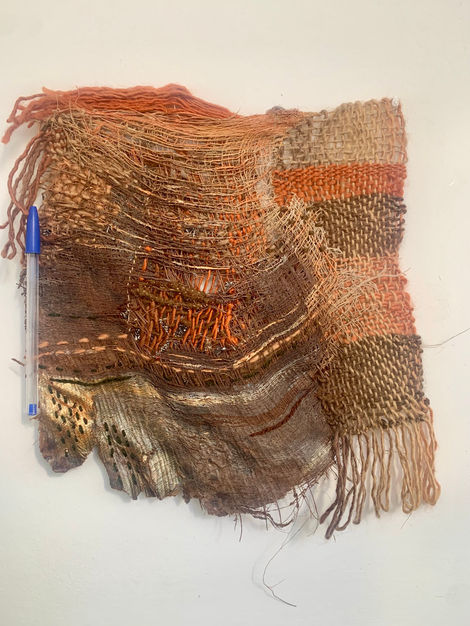 Palm tree treated with textile techniques such as loom-woven tapestry, embroidery, darning, sewing, and acrylic painting.