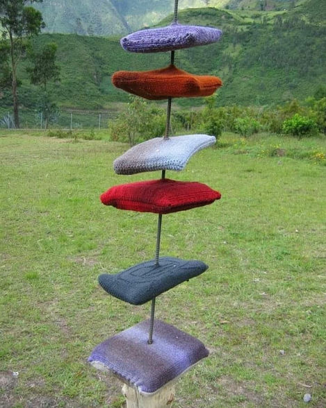Cushions covered with hand-woven wool fabric, steel bar, wood.