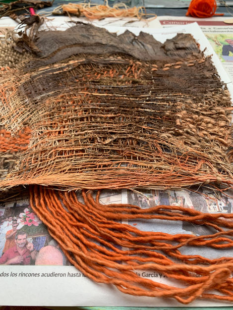 Palm tree treated with textile techniques such as loom-woven tapestry, embroidery, darning, sewing, and acrylic painting.