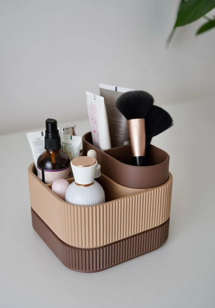 Stylish ribbed modern three section makeup organiser, lower and upper parts in Chocolate Brown, middle section is light Brown, displayed with a light grey background. Great gift for anyone for a organanised Bathroom or Dressing area. bathroom or dressing area .