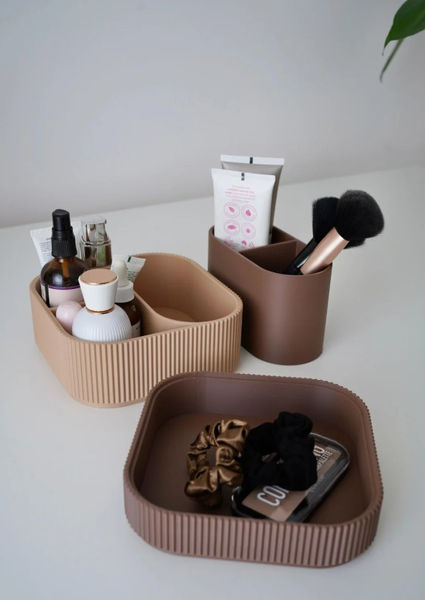 This Image is of the same organiser to the left but displayed with the trays open and seperated showing the storage potential for Makeup brushes, creams and lotions etc.