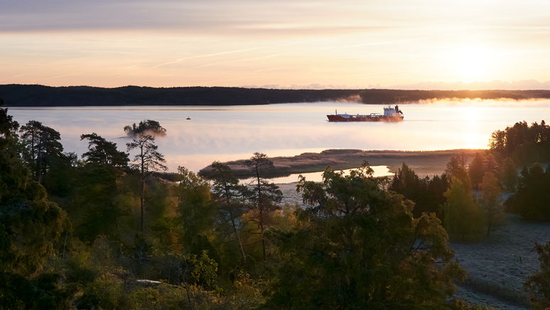 Cargo ship on its way thru the Stockholm archipelago on a cold frosty morning