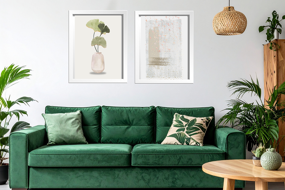 Green sofa with leaf-patterned pillows in a stylish living room. Two framed plant prints on the wall, wooden table with plants, cozy vibe.